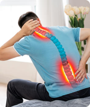 The back of a man who is holding his neck and lower back in pain. The spine is graphically represented with the painful areas marked in red.