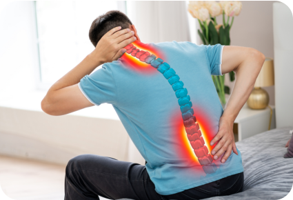 A man holds his neck and lower back in pain. The image of a spine is overlayed on the person's back and the painful areas are highlighted in red.